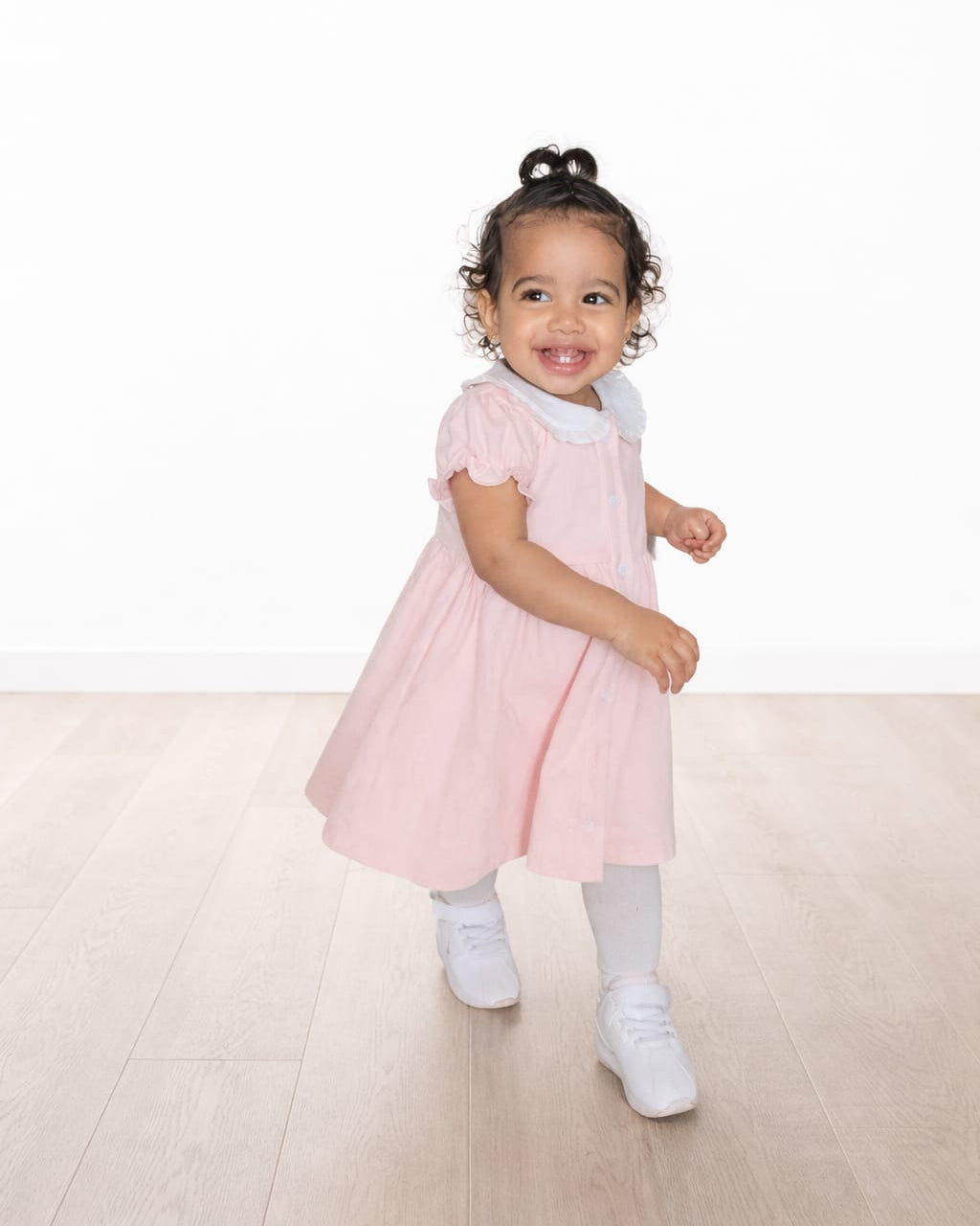 Smiling baby pink dress 